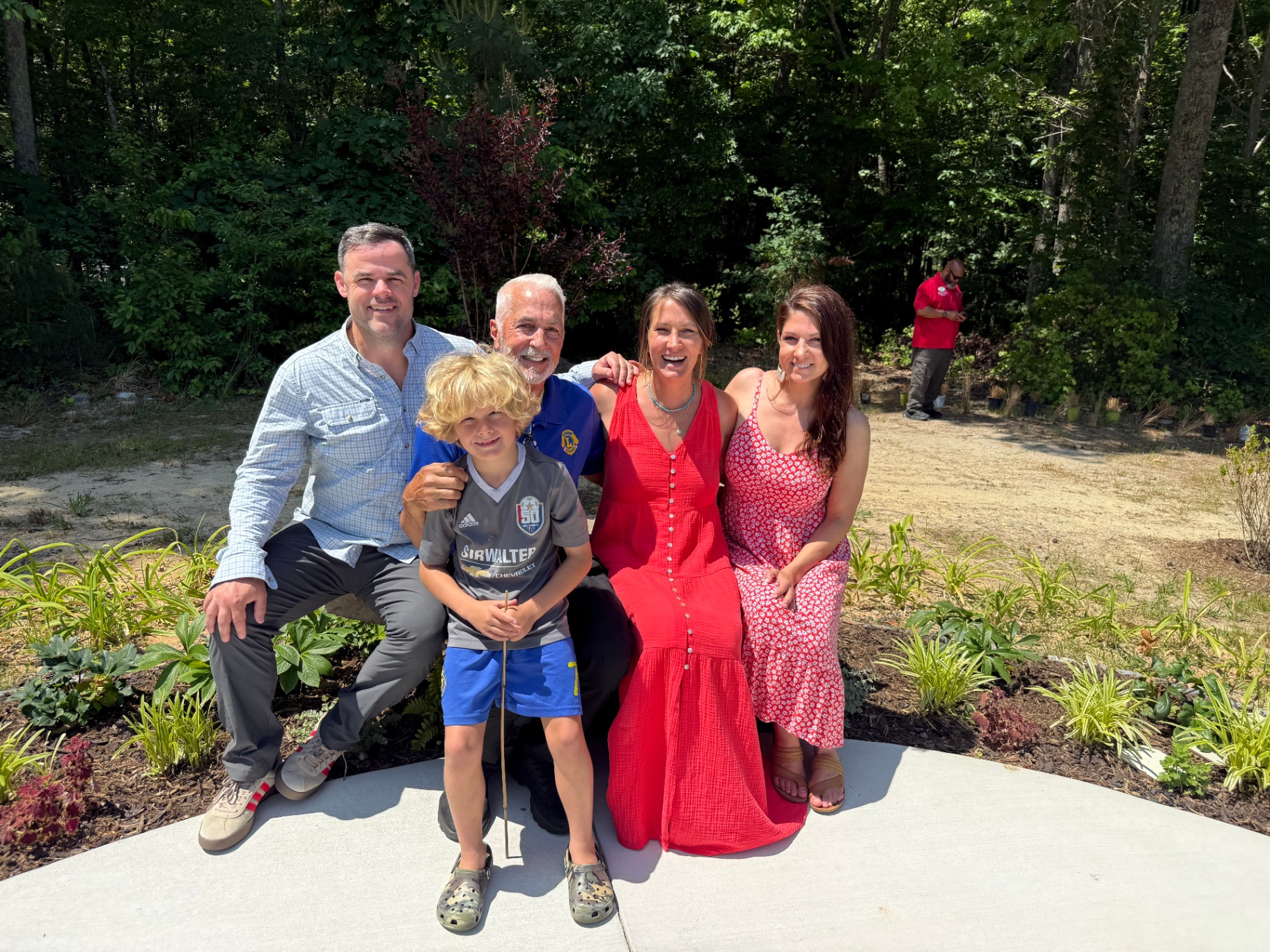 Family gathered in the garden on dedication day