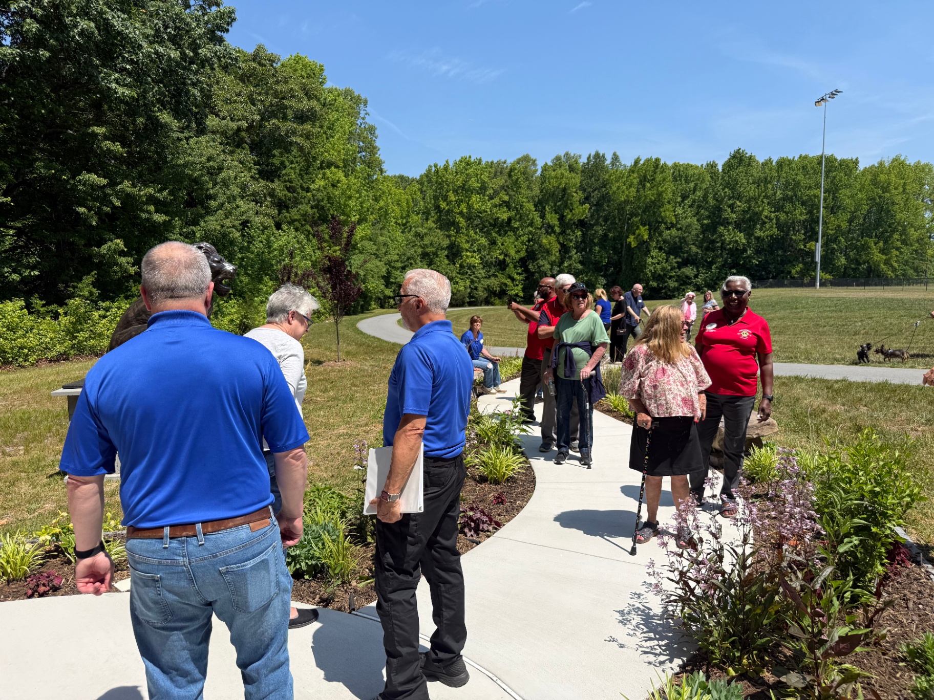 Lions Club members and visitors touring the pathway