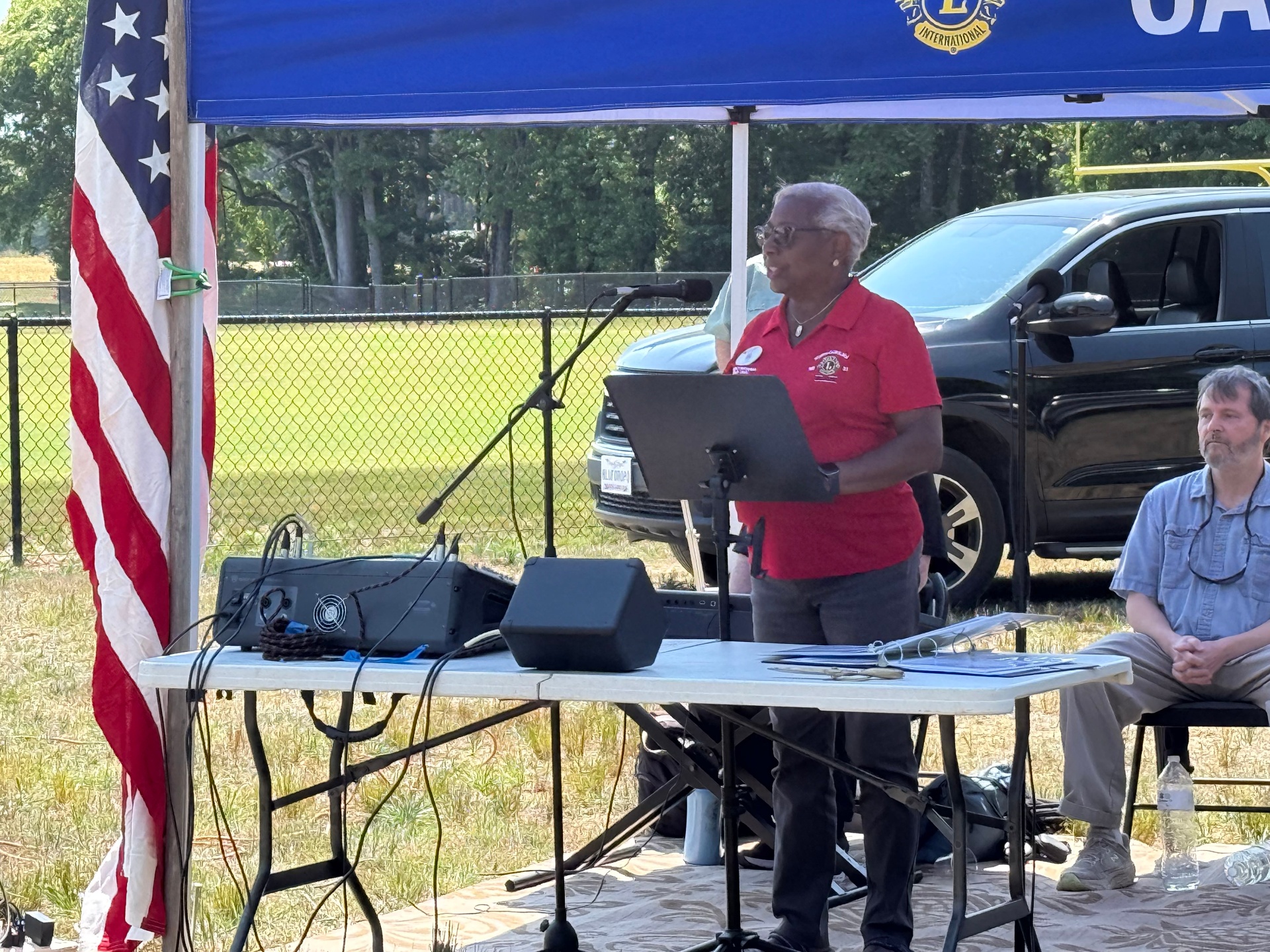 A Lions Club member speaking at the garden dedication